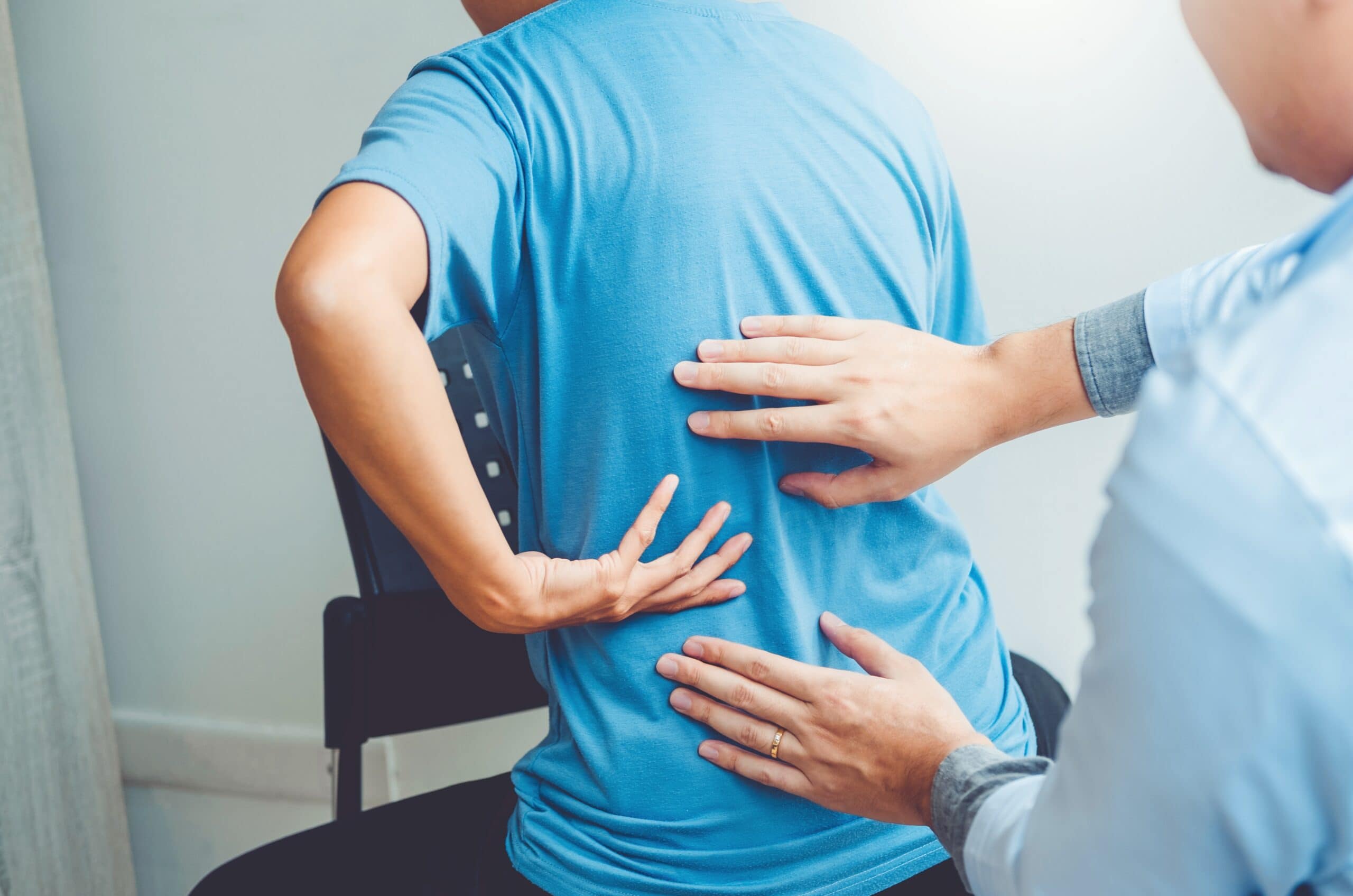 Physical therapist treating a patient with back pain