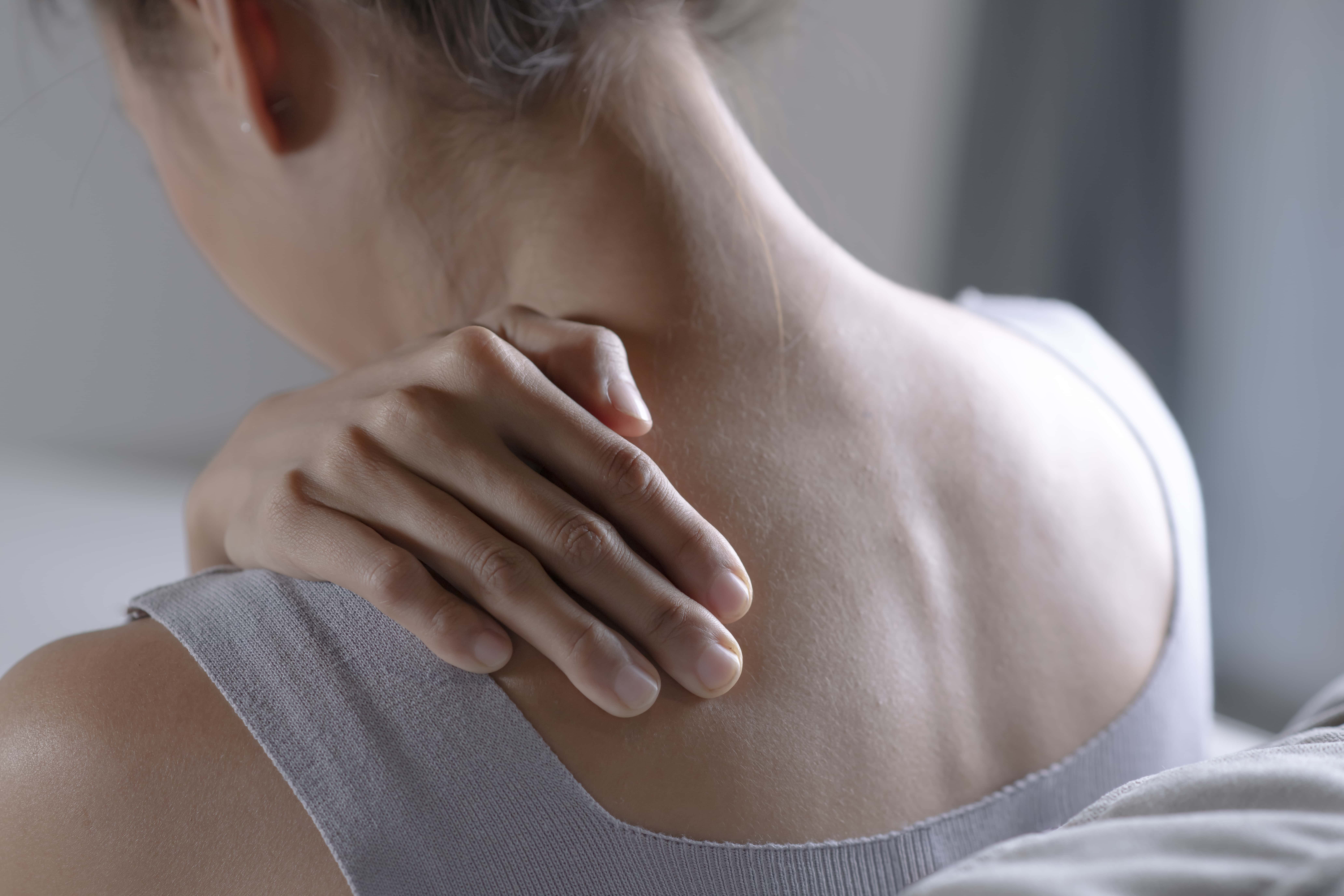 Physical therapist treating a patient with shoulder pain